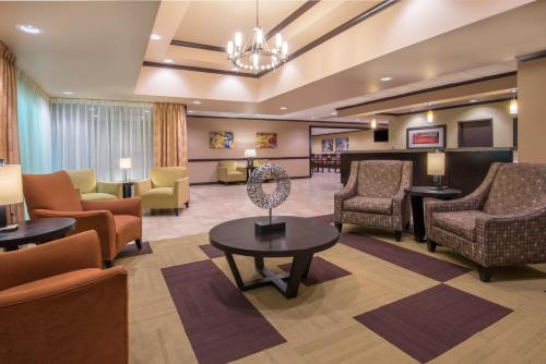 a lobby of a hospital with chairs and a waiting room at Wyndham Garden Oklahoma City Resort & Conference Hotel Near Airport, Fairgrounds Paycom & I40 in Oklahoma City