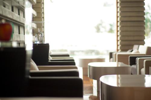 a row of chairs and tables in a restaurant at River Retreat Garaku in Toyama