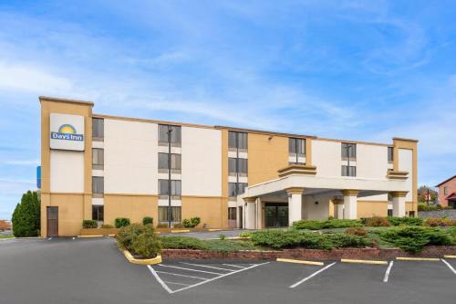 an image of a hotel with a parking lot at Days Inn by Wyndham Hagerstown I-70 in Hagerstown