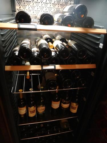 a refrigerator filled with lots of bottles of wine at Penzion u Bednářů in Pavlov