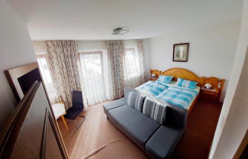 Postel nebo postele na pokoji v ubytování Gästehaus Bader