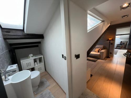 a bathroom with a sink and a toilet in a room at Charles in Verbania