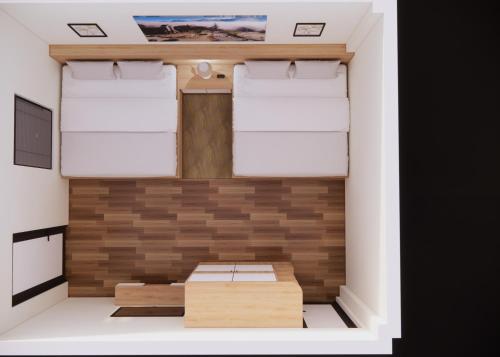 Giường trong phòng chung tại Sơn Trang House