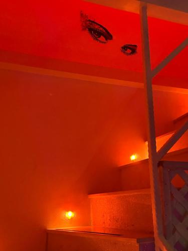 a room with red lights on a bunk bed at Rubino Private SPA & Room in Corato