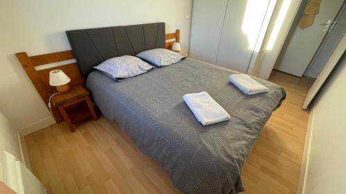 Giường trong phòng chung tại Gîte du bosquet