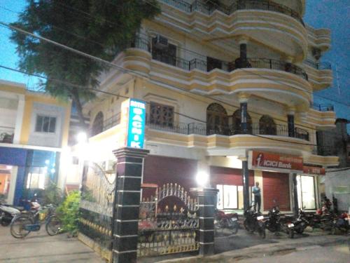 a building with motorcycles parked in front of it at hotel sagnik in Murshidābād