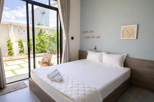 En eller flere senge i et værelse på Dượng Tài Homestay