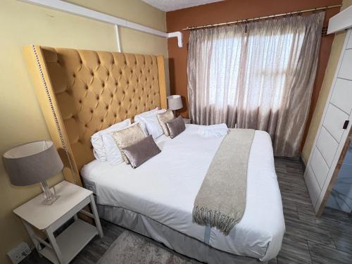 En eller flere senge i et værelse på East Coast Sunrise Boutique Hotel