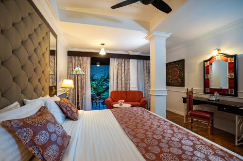 En eller flere senge i et værelse på Century Pines Resort Cameron Highlands