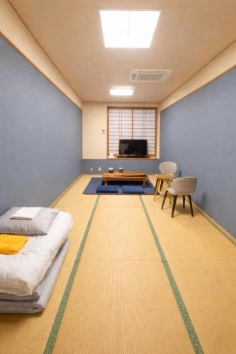 En eller flere senge i et værelse på 宿屋しの軒 2階