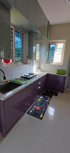 a kitchen with a sink and a counter top at 'Tatvamasi' Farmstay, Hillock The Nature Retreat, Vikarabad in Morangpalli