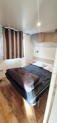 Giường trong phòng chung tại Mobilhome