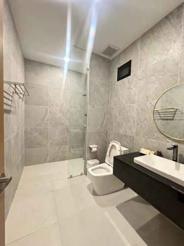 a bathroom with a toilet and a sink and a shower at TC villa on beach in Ko Larn