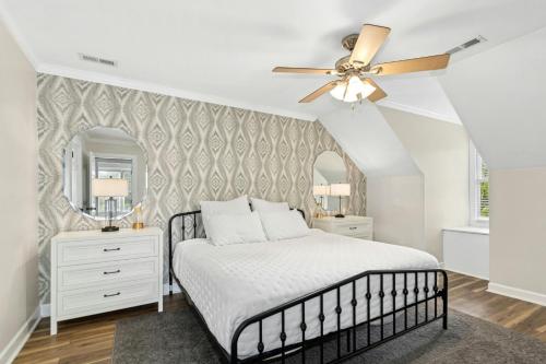 En eller flere senge i et værelse på Southern City Living