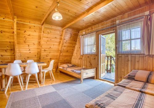 En eller flere senge i et værelse på "Domek na Wiejskiej 4" Polańczyk , 696-025-331