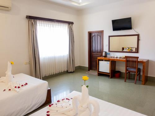 Llit o llits en una habitació de Share Happy Hotel