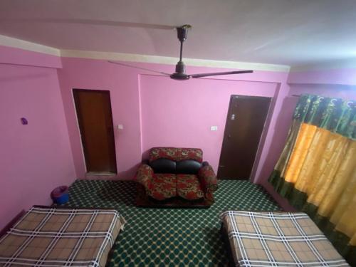 a living room with a couch and a chair at Hotel tulsi sagar Int'l pvt Ltd in Kathmandu
