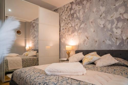 En eller flere senge i et værelse på Casa Yuliya 11