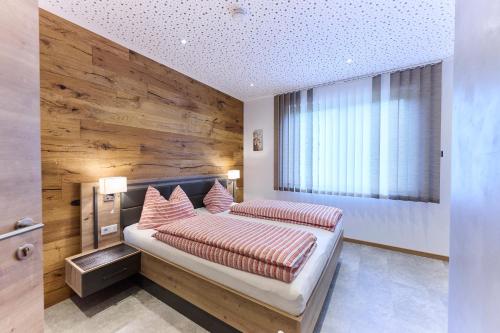 En eller flere senge i et værelse på Pension Seestüberl Doppelzimmer mit Balkon