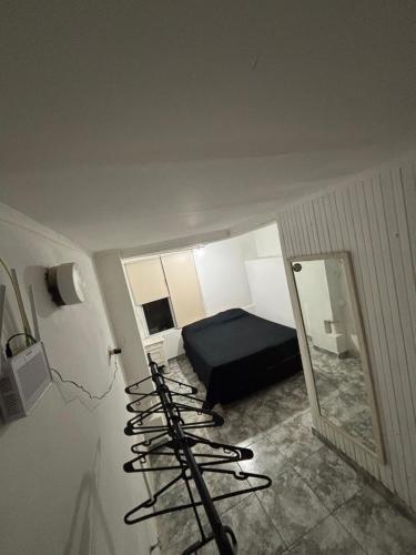 En eller flere senge i et værelse på Departamento Aqualuna