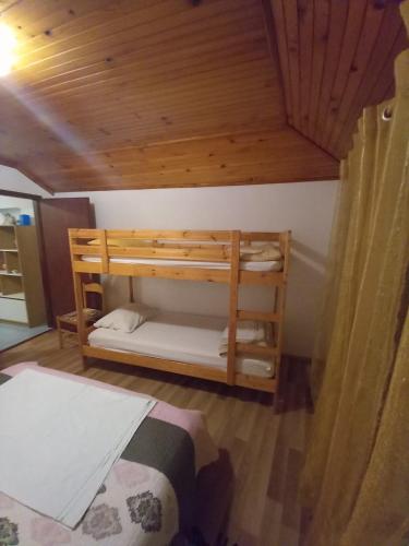 a bedroom with two bunk beds in a room at Apartmani Vidović Viganj in Viganj