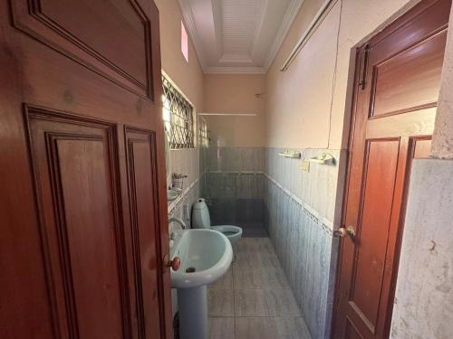 a bathroom with a sink and a toilet at Musa house D ground in Faisalabad