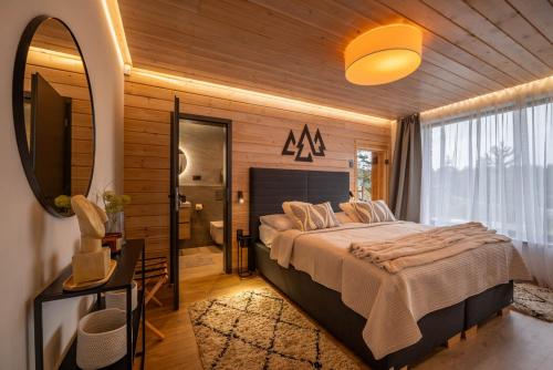 Giường trong phòng chung tại Apartmán STRÖMY Demänovská dolina