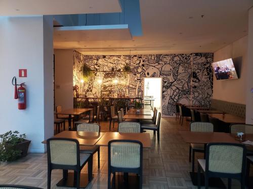 En restaurant eller et andet spisested på ArteStudios - Studios decorados Junto ao Projac, Farmasi, Riocentro e praias