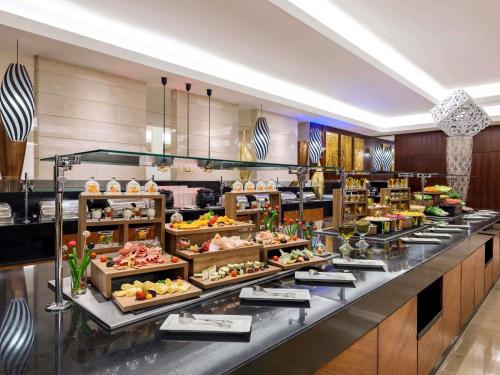 a buffet line with many different types of food at Swissotel Makkah in Makkah