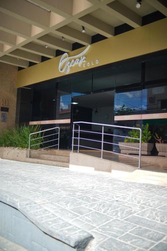 a building with a sign on the side of it at HOTEL OSCAR GOLD in Montes Claros