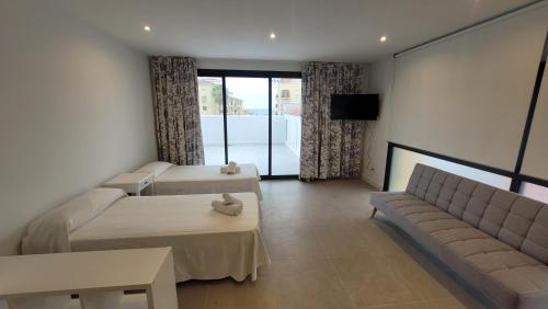 Et tv og/eller underholdning på hostal San luis apartamentos