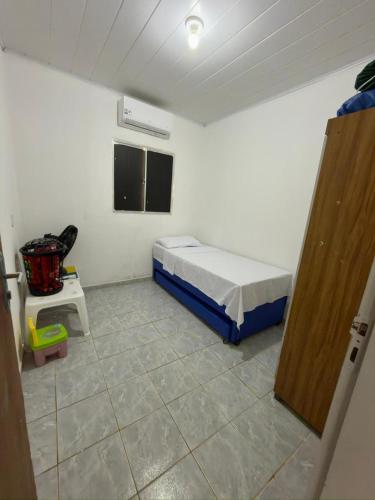 Giường trong phòng chung tại Casa de Praia no Centro de Japaratinga - AL