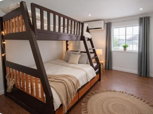 Giường trong phòng chung tại Clark International Airport Xevera Whiz Staycation Duplex Townhouse with Two Rooms