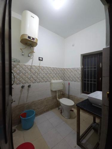 a bathroom with a toilet and a sink at JMC Homestay in Kukri Ser