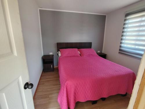 En eller flere senge i et værelse på Santo Bucalemu Lodge