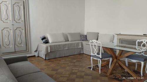 a living room with a couch and a table at FuoriPorta Affitti Brevi - L'Appartamento della Musica in Parma
