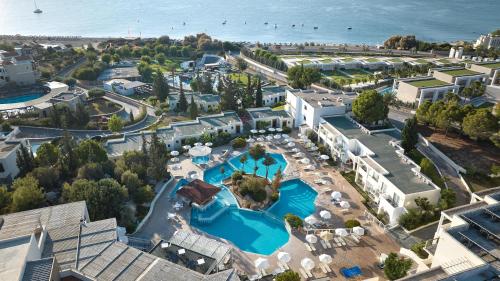 an aerial view of a resort with a swimming pool at Kiotari Miraluna Beach Resort in Kiotari