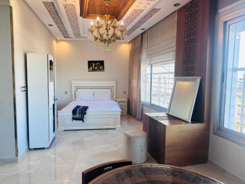 Postel nebo postele na pokoji v ubytování 3 Appartements Vue sur Mer dans une maison indépendante