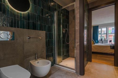 a bathroom with a shower and a toilet and a sink at Ca' De Carme' in Riomaggiore