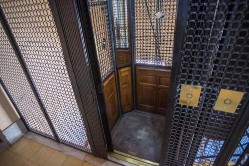 an open door to a room with metal walls at Departamento hasta 7 personas en Recoleta in Buenos Aires