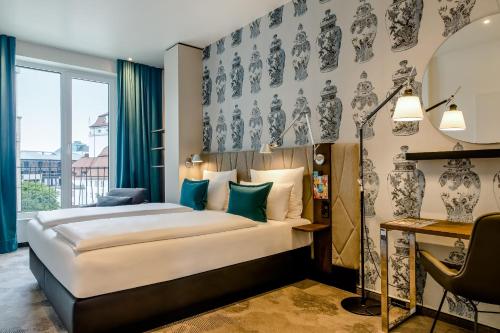 En eller flere senge i et værelse på Motel One Dresden am Zwinger