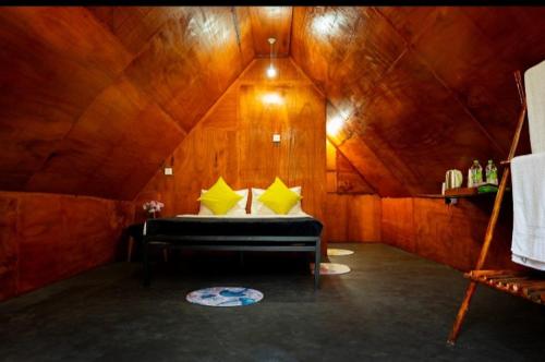 a room with a bed in a wooden tent at Ella Jungle Rock in Ella
