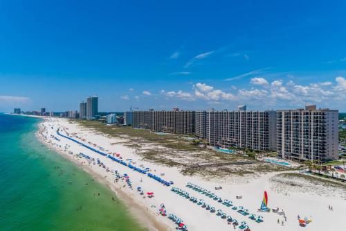 an aerial view of a beach in front of condos at Phoenix East II 2032 in Orange Beach