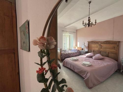 a bedroom with a bed and a large mirror at Cascina Teresina Monferrato Piscina in Cortazzone
