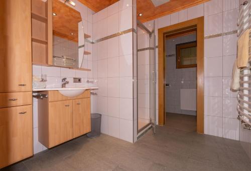 a bathroom with a sink and a toilet in a room at Panoramablick Ferienwohnung Schiestl in Brandberg