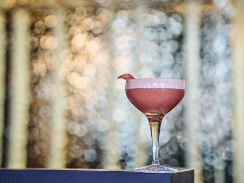 a wine glass sitting on top of a table at TRIBE Lyon Croix Rousse in Lyon