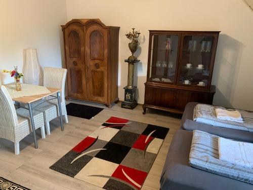 a living room with a table and a dining room at Studio 29 in Oberhausen