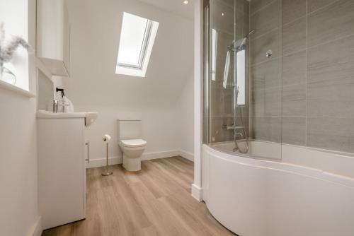 a bathroom with a tub and a toilet and a sink at 2 Bed in Tintagel oc-g33170 in Tintagel