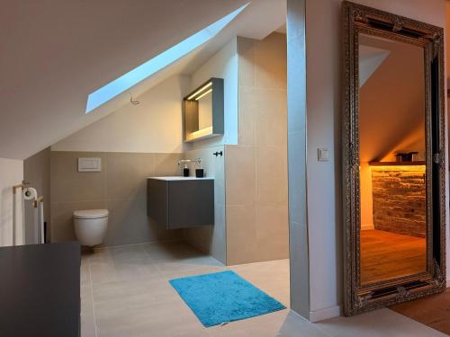 a bathroom with a sink and a mirror at Loft am Wappach in Bayerisch Gmain