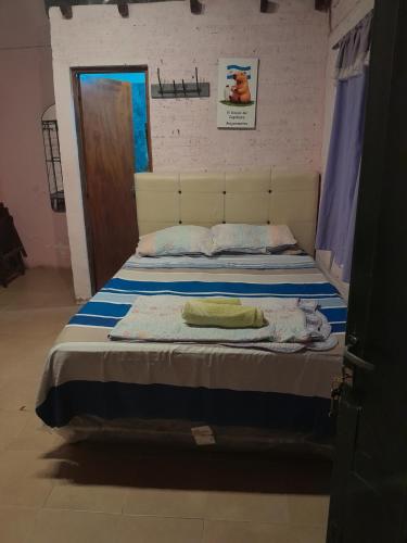 Giường trong phòng chung tại El Rincón del Capibara Alojamientos